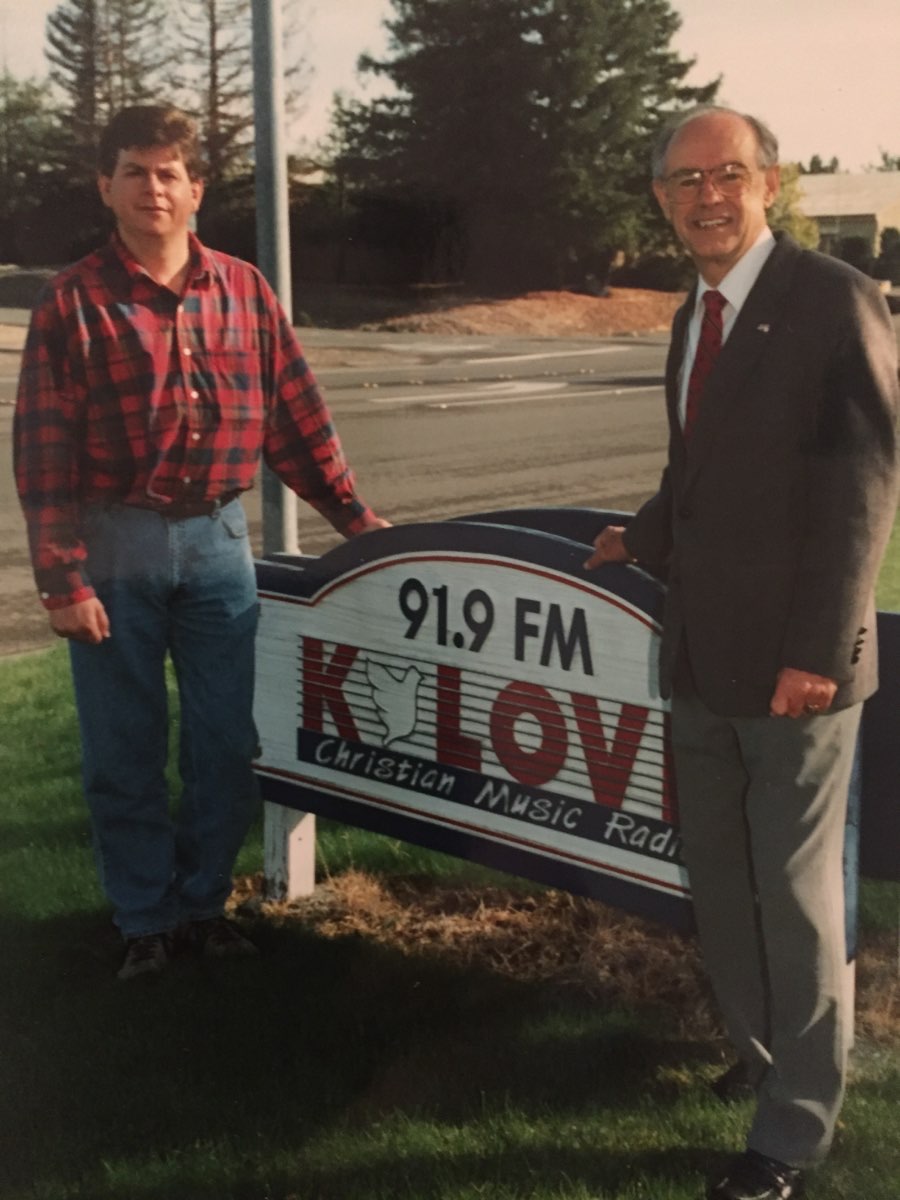 dj david pierce standing by the california k love studio sign in 1993